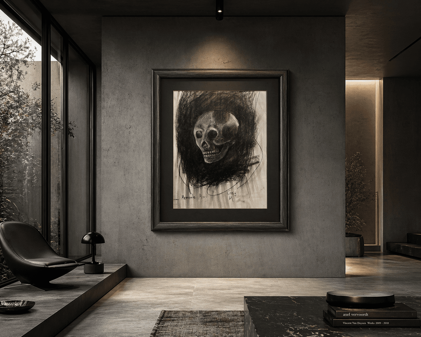 Framed charcoal skull drawing on a concrete wall in a dark, minimalist modern interior.